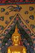 Bangkok Wat Arun - The covered passageway around the ubosot is lined with 120 Buddha statues in the sitting position.  